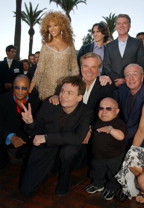 Director Jay Roach (top, center) with cast members at the <i>Goldmember</i> red carpet.