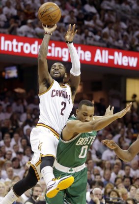 Clear out: Cleveland Cavaliers guard Kyrie Irving shoots over Boston Celtics opponent Avery Bradley. Irving made the basket and the free throw on his way to a 30-point afternoon in the Cavaliers' 113-100 win. 