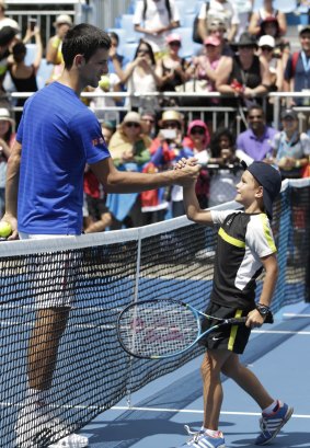 Novak Djokovic makes a child's day.