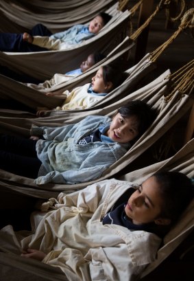 The students donned oversized convict clothes and set about learning the finer points of hammock comfort.