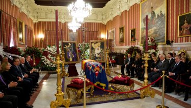 Visitors pay their respects to Spain's Duchess of Alba as her body lies in Seville.