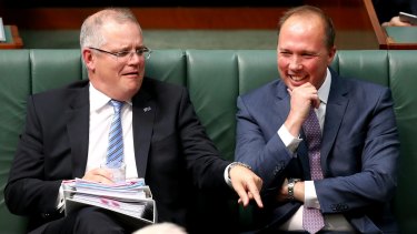 You don't want to know what sort of joke would make Scott Morrison and Peter Dutton laugh this hard. That said: what's Scotty pointing at?