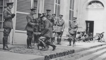 King George V, knighting Lieutenant-General Sir John Monash, Australian Corps commander, at the corps headquarters in August 1918.