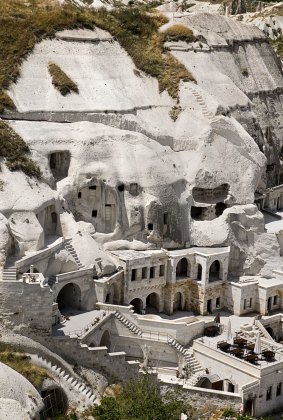 A cave hotel built in white tufa rock in Cappadocia, Turkey.