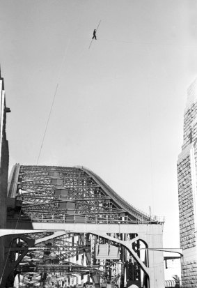 Stopping traffic: Petit walks between the two pylons of the northern side of the Sydney Harbour Bridge in 1973.