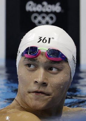 China's Sun Yang rests after bombing out in the men's 1500m freestyle heat on Friday.
