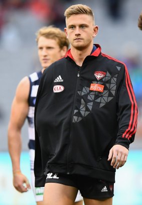 Bomber Jayden Laverde leaves the ground after injuring his shoulder during the round four match against Geelong.