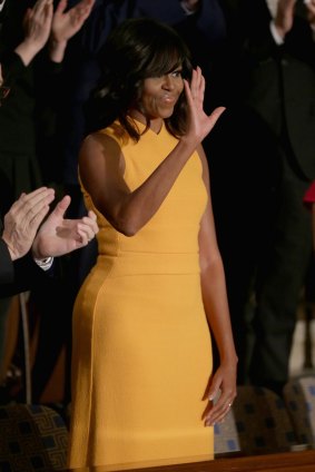 Michelle Obama waves to members of congress before US President Barack Obama delivers the State of the Union speech on January 12, 2016 in Washington, DC. 
