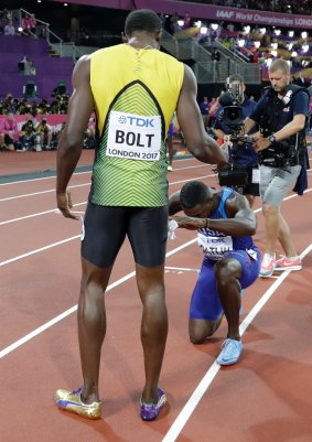 Paying respects: Gold medal winner Justin Gatlin bows down to Usain Bolt, who took bronze in his final solo race.