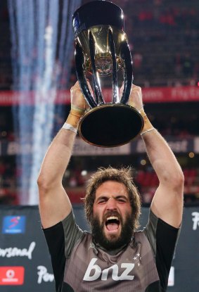 Drought over: Skipper Sam Whitelock hoists the trophy.