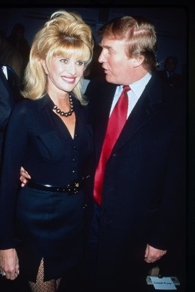 Ivana and Donald Trump pose together at a Betsey Johnson fashion show in Bryant Park, New York, New York, 1997.