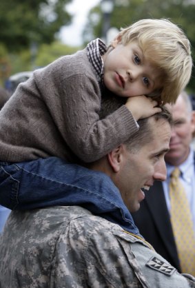 Beau Biden carries his son Hunter, three, on his shoulders after returning from service in Iraq.