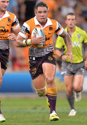 Corey Parker of the Broncos runs with the ball during round three against the North Queensland Cowboys at Suncorp Stadium.