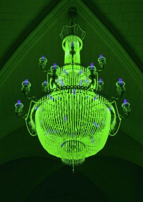 Ken and Julia Yonetani's chandeliers glow green with uranium glass.