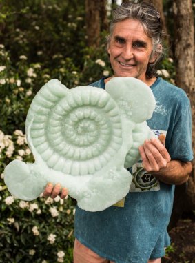 Rob Hayley and his cast glass ammonite. 
