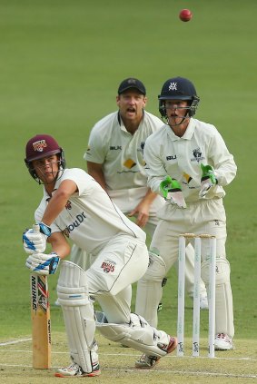 Mitchell Swepson of Queensland bats on day one of the Sheffield Shield match against Victoria at The Gabba.