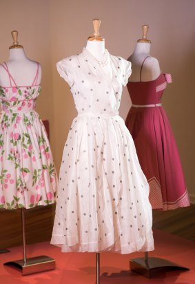 Barbara Coty polka-dot screen-printed, white organdie sleeveless dress with floating "petal" skirt sections with bias-cut trim, made in 1951 at East Sydney Tech. On display as part of Garden Part exhibition at Maroondah Art Gallery, Ringwood.