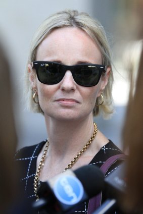 Mrs Night leaves the Brisbane District Court on Friday after her former partner was jailed.