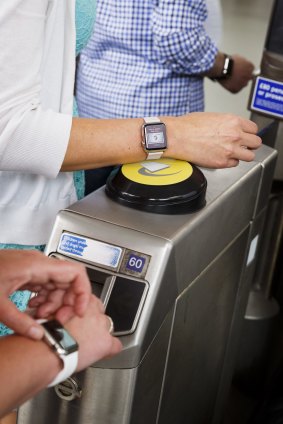 Customers use Apple Watches to pay fares in the London Underground.