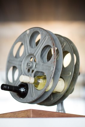 Film reels have been recycled as wine racks.