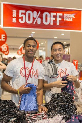 First-year University of Canberra student Jeremy Mututu, 18 of Isaacs and his colleague Michael Santos, 16 of Franklin, working the sales for the first time.

