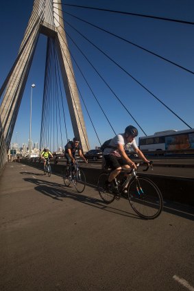 Cyclists leaving the city along Anzac Bridge during evening peak hour. 