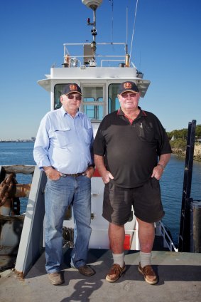 Tugboat skippers Peter Fenton (right) and Doug Hislop, who were nominated for bravery awards after risking their lives to prevent a potential catastrophe on the raging Brisbane River during the flood crisis.