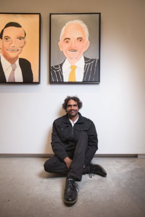 Vincent Namatjira with his portraits of Tony Abbott and Malcolm Turnbull, part of the TarraWarra Biennial.