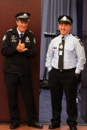 Sergeant Gary Hamrey (left) and Senior Constable Steven Cook play it up for the cameras.