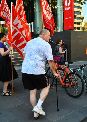 Injured worker Graeme Brown joined the protest outside the Australia Post headquarters.
