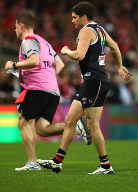 Hamstrung: The Saints' Leigh Montagna limps off in the match against Sydney on Saturday.