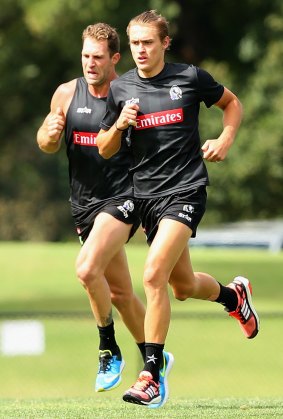Darcy Moore training with Travis Cloke.