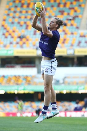 Fyfe warming up with the vest on before the Dockers clash with the Lions.