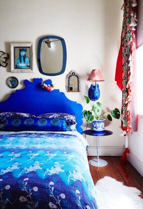 Peter made the bedhead and painted it in Yves Klein blue, their favourite hue. The light is hand-carved.