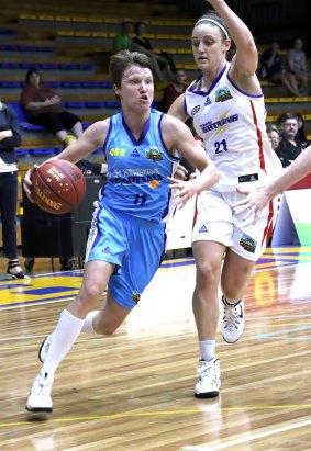 Canberra’s Jess Bibby takes on the Adelaide defence during a pre-season match last Saturday.