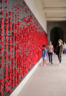 Visitors at the Roll of Honour at the Australian War Memorial.