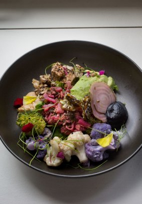 Kale kimchi bowl with broccoflower, savoury praline, pickled beetroot, avocado, activated charcoal puree and buckwheat loaf.