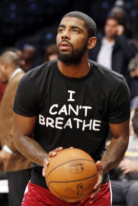 Protest: Basketball star Kyrie Irving wears a shirt bearing Eric Garner's last words before an NBA game on Monday night.