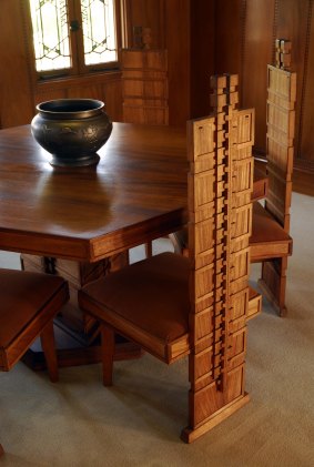 Hollyhock House: Inside Frank Lloyd Wright's stucco sensation is a hexagonal table with detailed high-backed chairs.