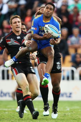 Flying high: Chris Sandow takes a bomb for Parramatta during the loss to the New Zealand Warriors at Mt Smart Stadium.