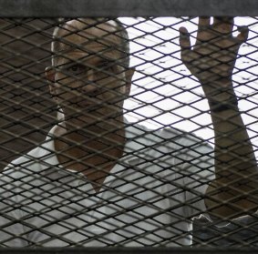 Peter Greste inside the defendants cage during his trial in June, 2014.