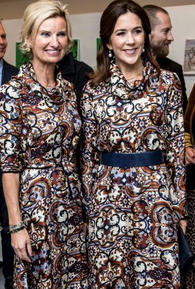 Danish Crown Princess Mary (R) and Nina Wedell-Wedellsborg, a member of the prize committee, wear the same dress at the Magasin du Nord Fashion Prize 2017 ceremony in Copenhagen.