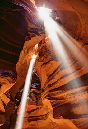 Just magical: Shafts of light streaming into Antelope Canyon, US.