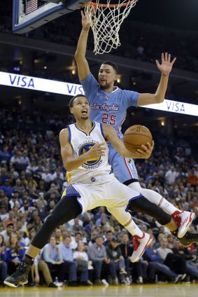 Smooth operator: Golden State Warriors guard Stephen Curry is fouled by Los Angeles Clippers opponent Austin Rivers.