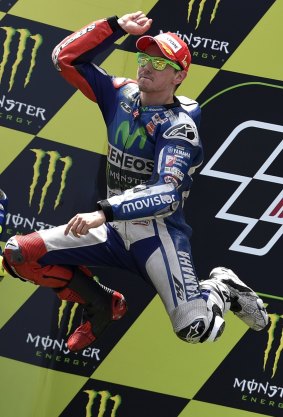 Lorenzo leaps for joy on the podium.