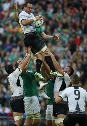 Romania's Daniel Carpo wins a lineout for Romania.