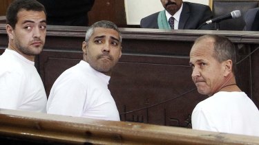 Peter Greste with his al-Jazeera English colleagues Baher Mohamed, left, and Mohamed Fahmy in court in Cairo in 2014.
