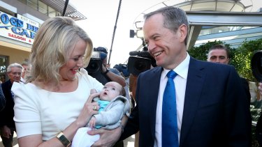 Opposition Leader Bill Shorten and Chloe Chorten meet with 6-week-old baby Lexi-Rose during a street walk in Queensland.