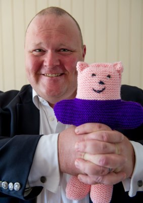 ACT Liberal candidate Paul Sweeney, with the "trauma teddies" he distributes to victims of crime, this year.