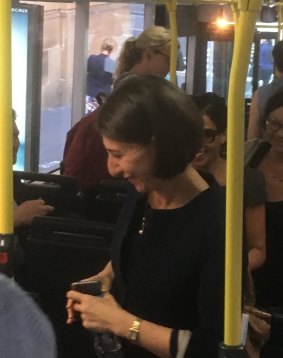 Gladys Berejiklian alights the 205. 